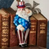 Raz Eric Cortina 5.5" Patriotic Santa Glass Christmas Ornament 4353129 -The Christmas Shop 4353129 27797.1710437985